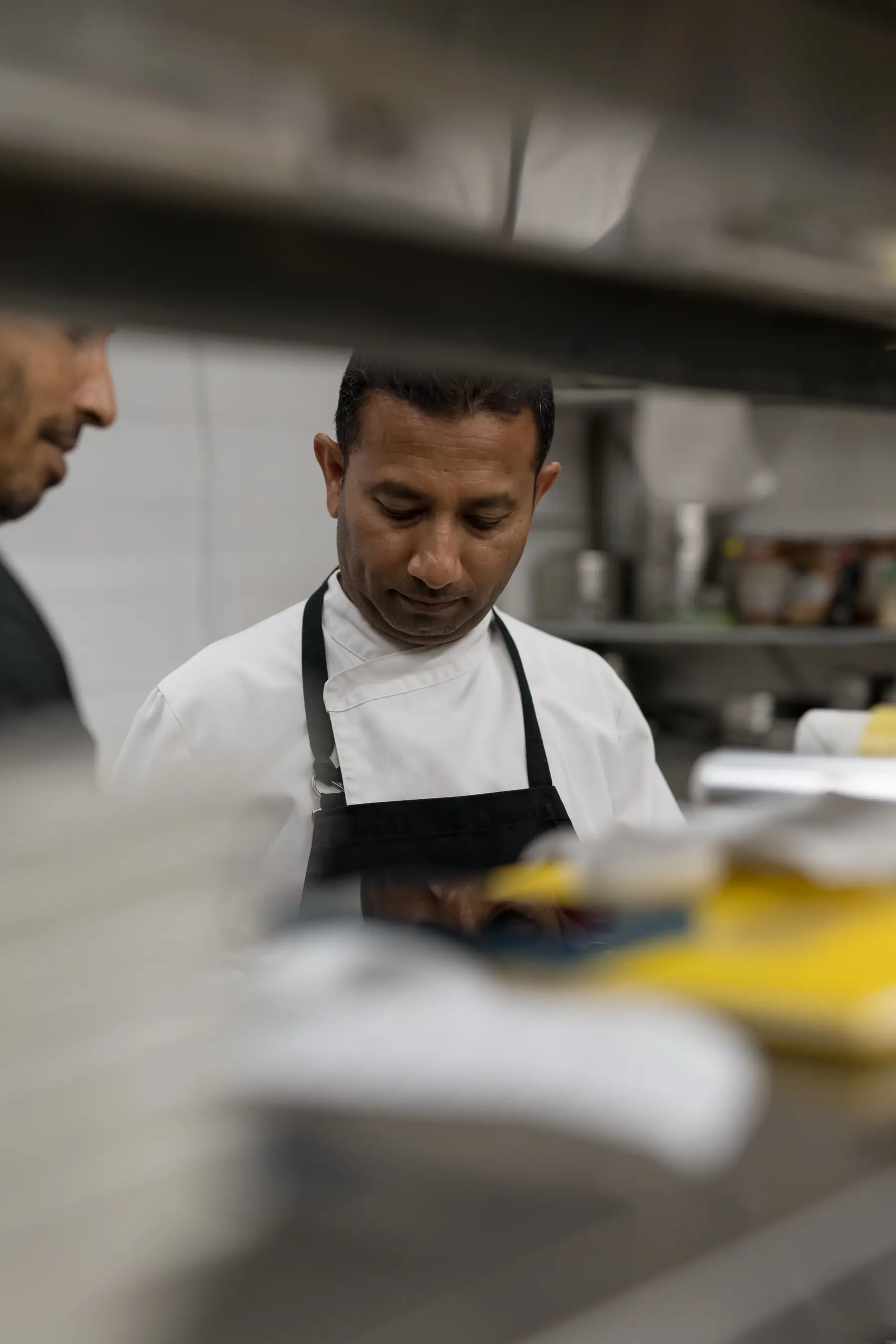 Chef plating a seasonal Naxian dish in Avgi kitchen